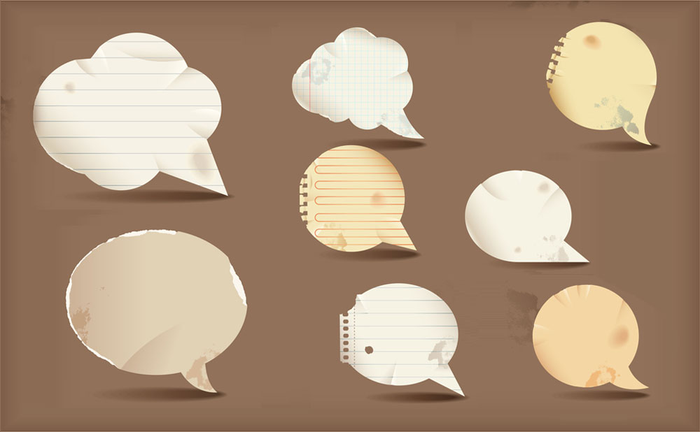 Different types of speech bubbles on a brown background symbolizing language interpreration services.